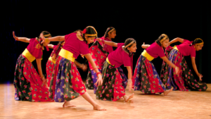 children dancing in traditional Nepali dress