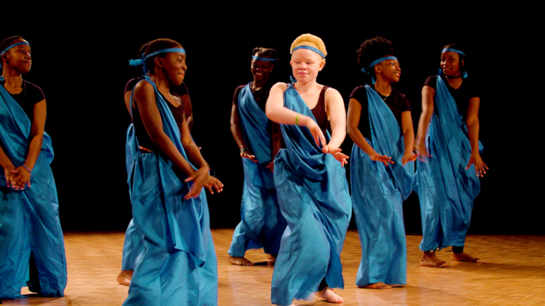 children dancing in African traditional dress